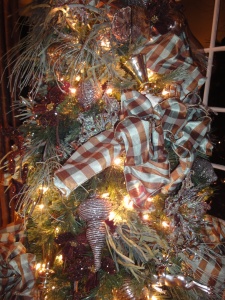 Plaid ribbon in tones of blue, gold and brown perk up this tree